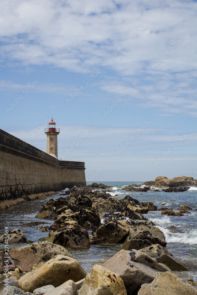 View from Carneiro beach in Porto to pier and lighthouse Felgueiras.