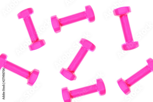 Pink dumbbell pattern on white background with copy space, isolated. Creative layout for sport fitness equipment concept. Minimal style, flat lay, top view. Copy space