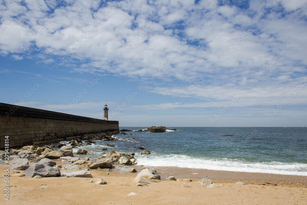 View from Carneiro beach in Porto to pier and lighthouse Felgueiras.