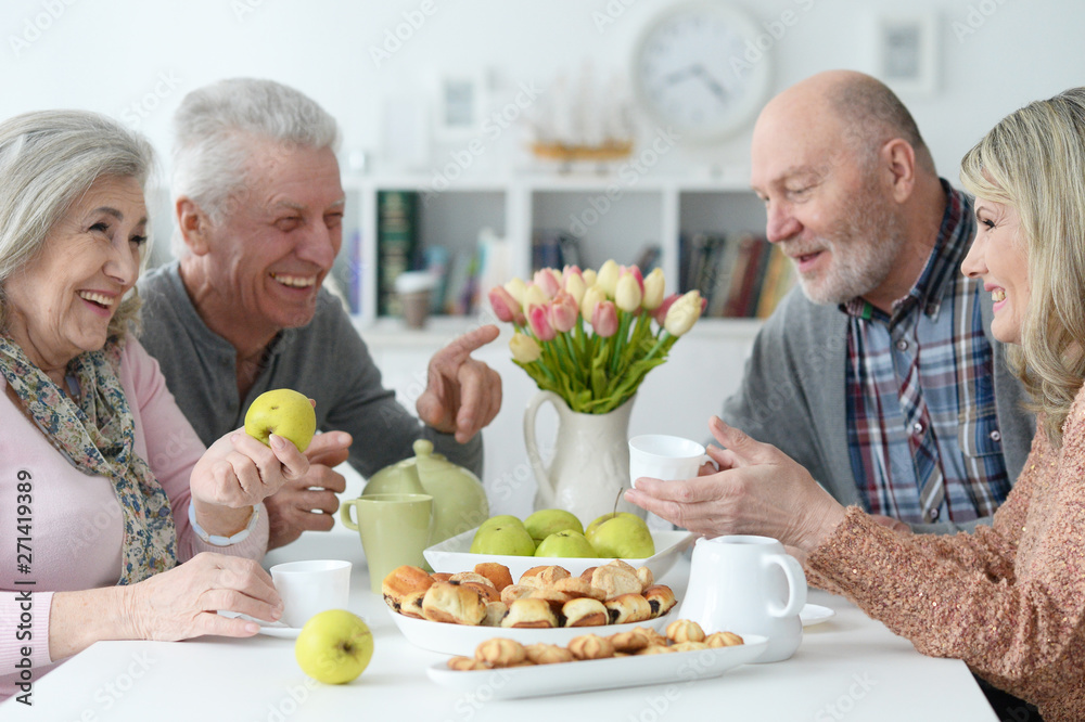 Portrait of two senior couples drinking tea Portrait of two senior couples drinking tea