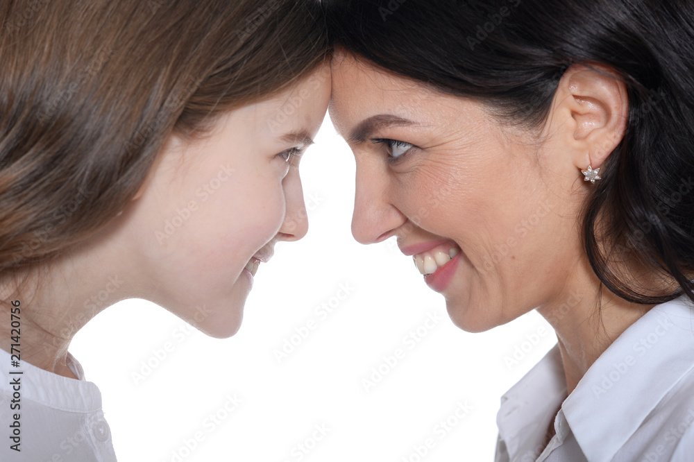 Portrait of happy mother and daughter posing on white background Portrait of happy mother and daughter posing on white background