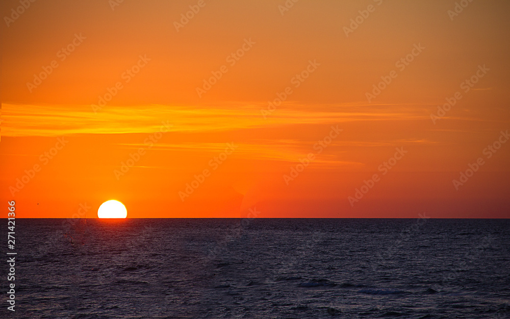 sunrise over the sea, horizon line, bright beautiful sky, sea vacation