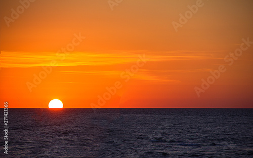 sunrise over the sea, horizon line, bright beautiful sky, sea vacation © Valentyna