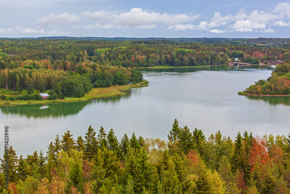 Aerial view of nature landscape with river and sea channel among the forest at Aland Islands, Finland