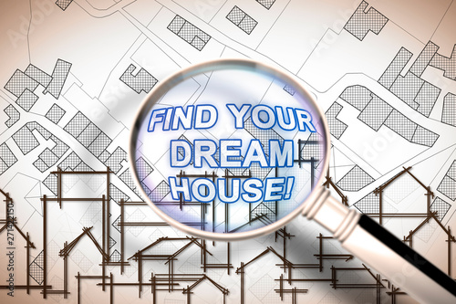 Find your dream house - Searching for a new home concept image with an imaginary city map of territory with buildings and roads through magnifying glass photo
