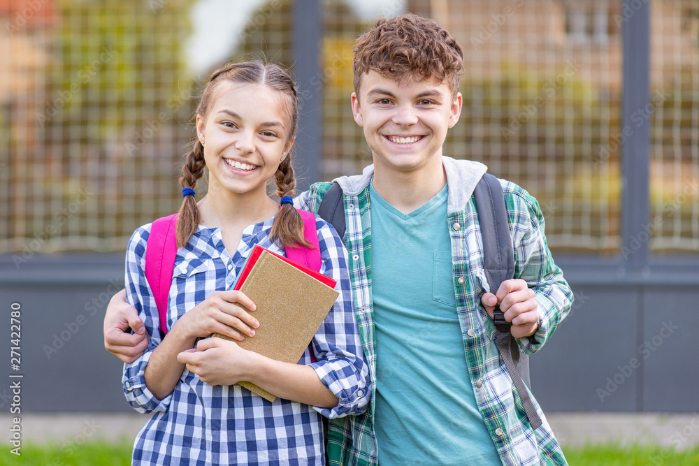 Teen boy and girl back to school Stock Photo | Adobe Stock