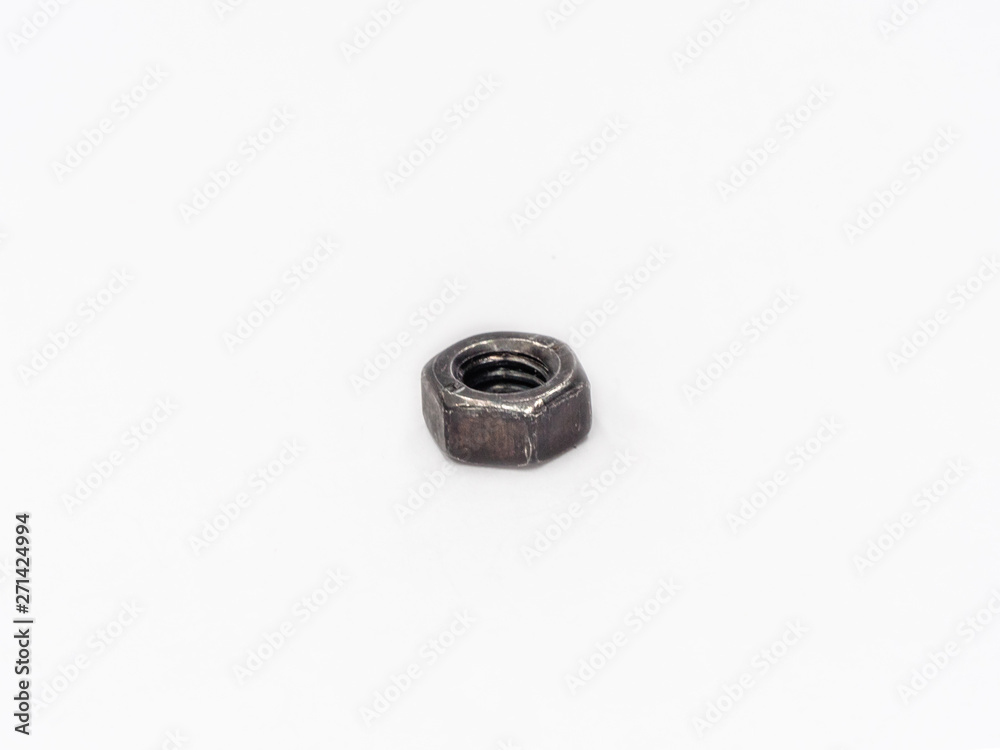 Black zinc plated hexagonal metric nut on white. Black zinc plated hexagonal metric nut on white.