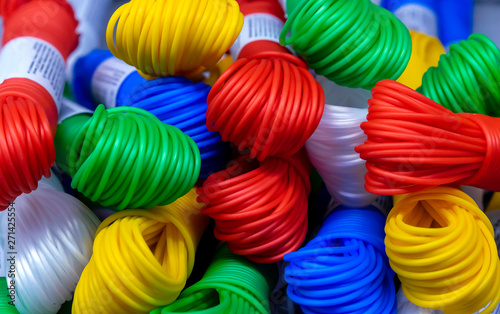 Colored plastic rope. Multicolored plastic wires in bundles.