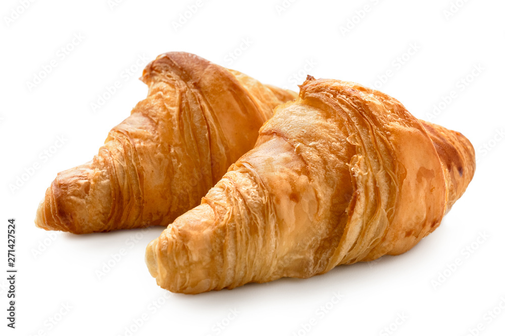 Two baked plain croissants isolated on white.