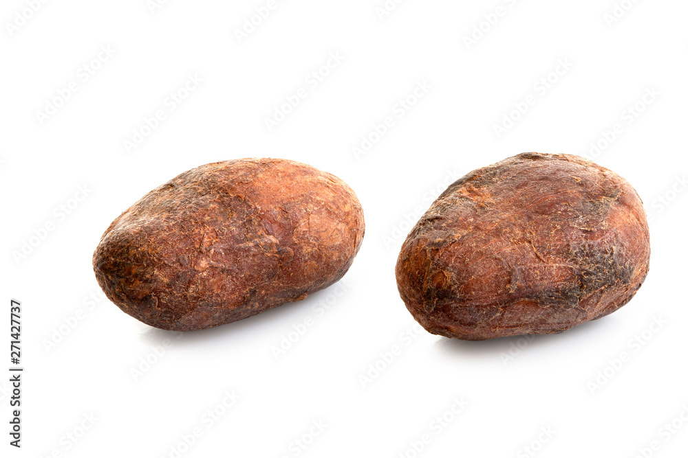 Two roasted unpeeled cocoa beans isolated on white. Two roasted unpeeled cocoa beans isolated on white.
