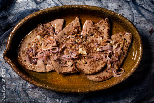 higado encebollado, a spanish recipe of cow liver. photo