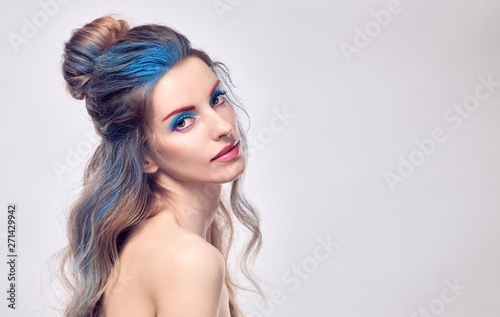 Beauty fashion woman portrait. Sensual blonde with art paint makeup, styling wavy hair, healthy skin. Beautiful slim model girl, fashionable Dyed hairstyle. Creative professional fantasy make up