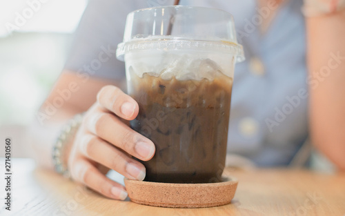  Cold coffee on the woman's hand