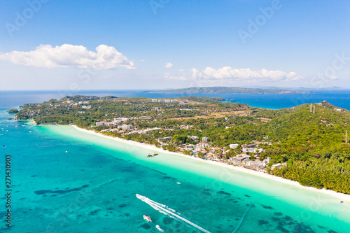 White beach on the island of Boracay, Philippines, top view. White sandy beach and turquoise sea water in sunny weather. Residential development and many hotels in Boracay.