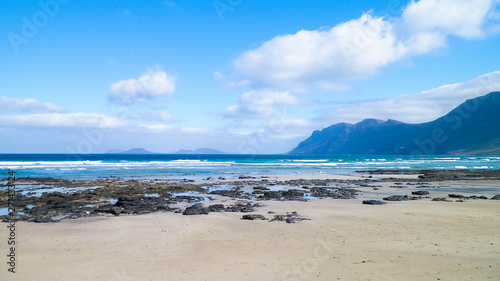 Beach and mountains - beautiful coast in Caleta de Famara, Lanzarote Canary Islands.