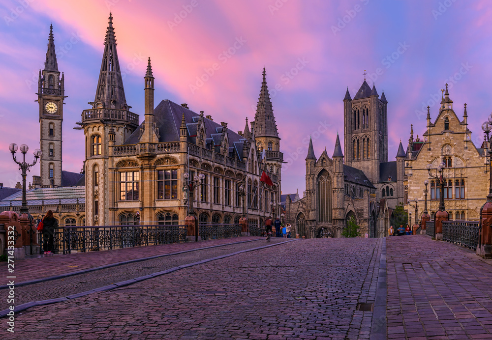 Medieval city of Gent (Ghent) in Flanders with Saint Nicholas Church and Gent Town Hall, Belgium. Sunset cityscape of Gent.