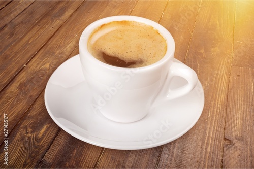 Coffee cup on wooden background