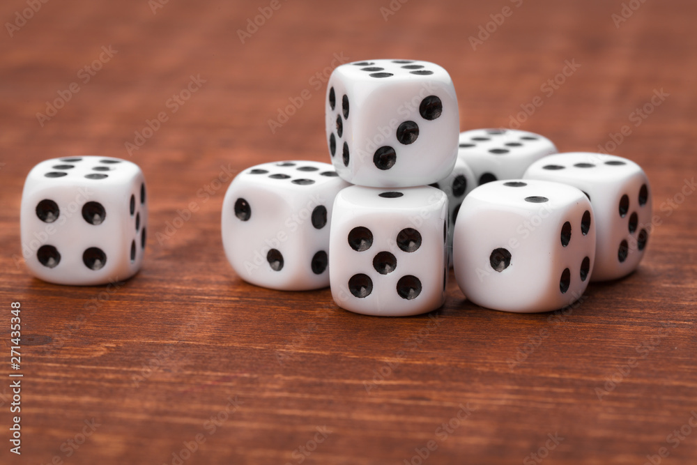 Dice on wooden table. Background for casino games. Dice on wooden table. Background for casino games.