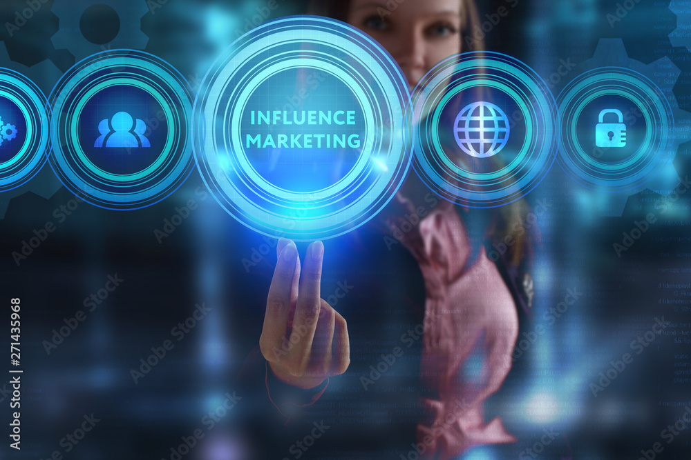 The concept of business, technology, the Internet and the network. A young entrepreneur working on a virtual screen of the future and sees the inscription: Influence marketing The concept of business, technology, the Internet and the network. A young entrepreneur working on a virtual screen of the future and sees the inscription: Influence marketing