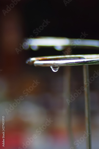 Iron ring with water droplets after rain On the community background