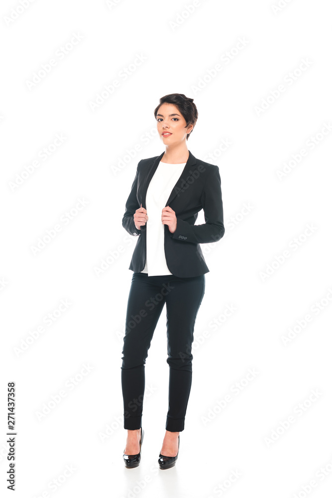 smiling mixed race businesswoman in formal wear looking at camera isolated on white smiling mixed race businesswoman in formal wear looking at camera isolated on white
