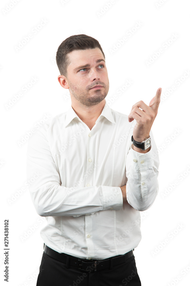 friendly young man pointing to his side and looking into the camera. isolated on white background friendly young man pointing to his side and looking into the camera. isolated on white background