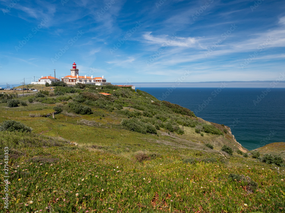 Cabo da Roca, Portugal. Lighthouse and cliffs over Atlantic Ocean, the most westerly point of the European mainland. May, 2019