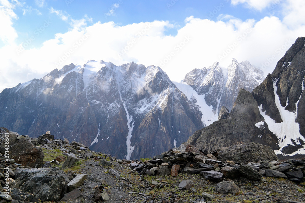 View of the snowy mountains on a sunny day. View of the snowy mountains on a sunny day.