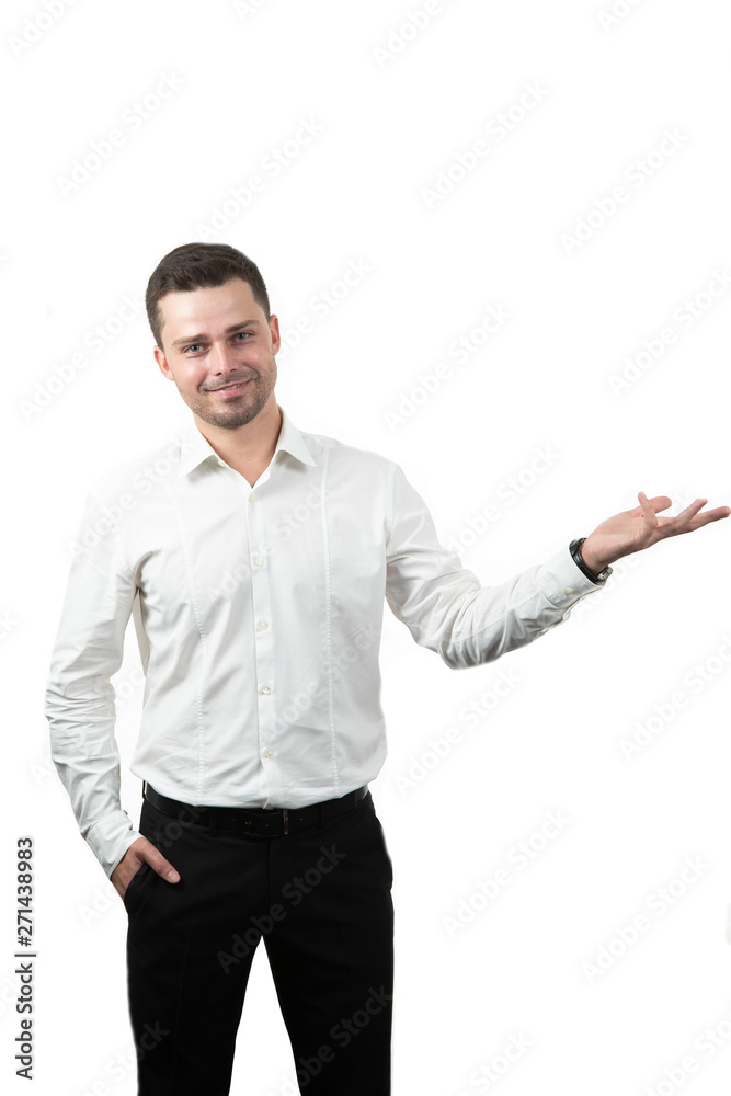 friendly young man pointing to his side and looking into the camera. isolated on white background friendly young man pointing to his side and looking into the camera. isolated on white background