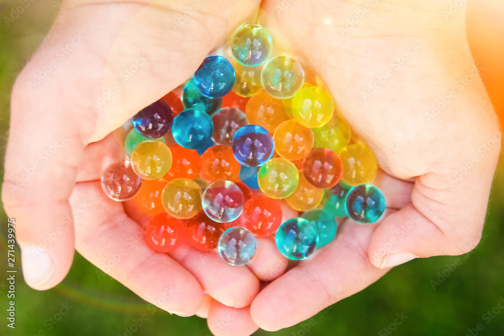 nice background of different colors balls in hands nice background of different colors balls in hands