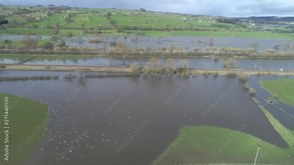 aerial drone following railway and main road through flood Yorkshire, UK aerial drone following railway and main road through flood Yorkshire, UK