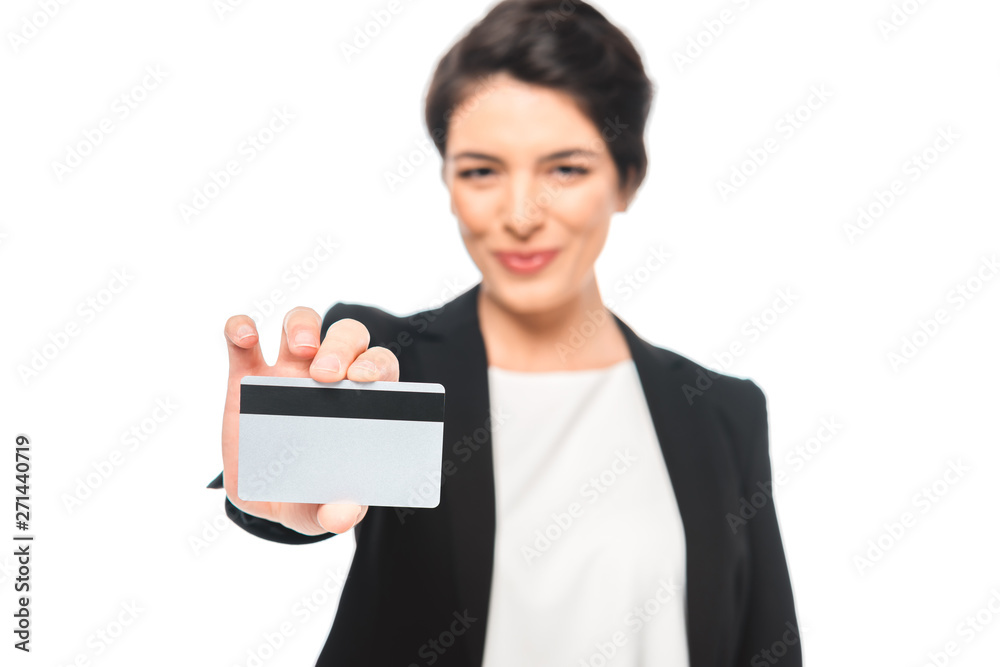 selective focus of smiling mixed race businesswoman showing credit card isolated on white selective focus of smiling mixed race businesswoman showing credit card isolated on white