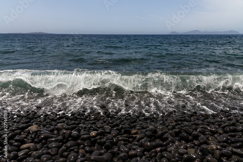 Fototapeta Naklejka Na Ścianę i Meble -  Aegean sea wave on volcanic beach in Nisyros island, Greece.
