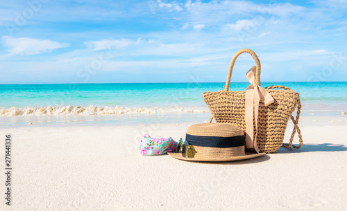 Hats and glasses placed on the beach and sea have a holiday summer relaxing and travel bright sky koh lipe thailand