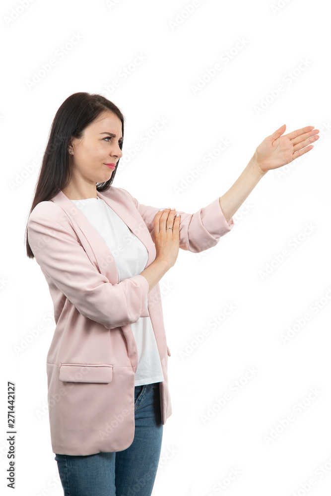 friendly young woman pointing to his side and looking into the camera. isolated on white background friendly young woman pointing to his side and looking into the camera. isolated on white background