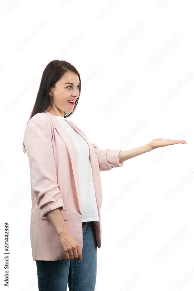 friendly young woman pointing to his side and looking into the camera. isolated on white background friendly young woman pointing to his side and looking into the camera. isolated on white background