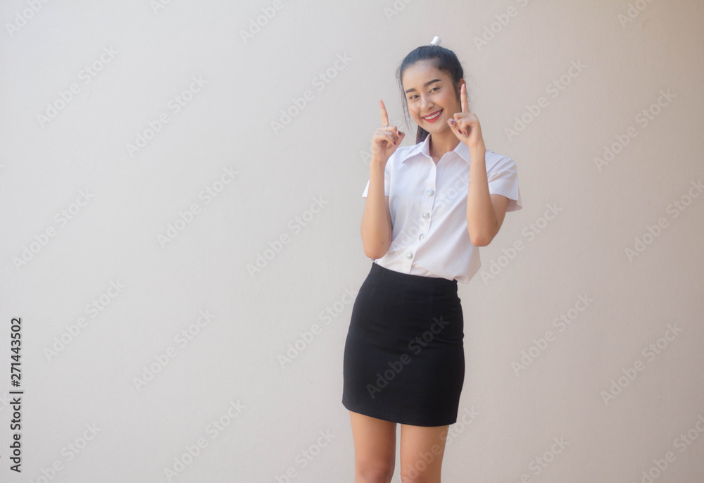 Portrait of thai adult student university uniform beautiful girl pointing Portrait of thai adult student university uniform beautiful girl pointing