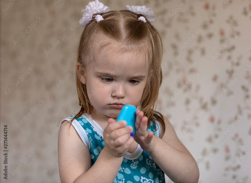 Portrait of a little girl playing with enthusiasm in the room. Portrait of a little girl playing with enthusiasm in the room.