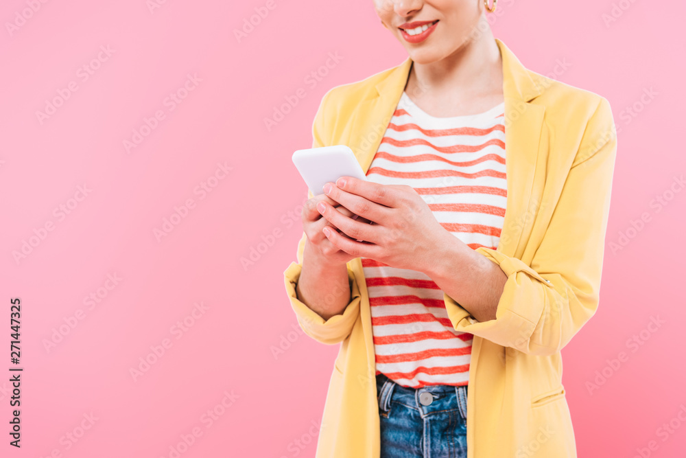 cropped shot of mixed race woman using smartphone isolated on pink cropped shot of mixed race woman using smartphone isolated on pink