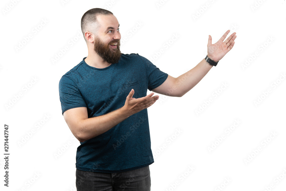 friendly young man pointing to his side and looking into the camera. isolated on white background friendly young man pointing to his side and looking into the camera. isolated on white background