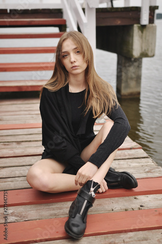 Stylish girl posing in stylish clothes
