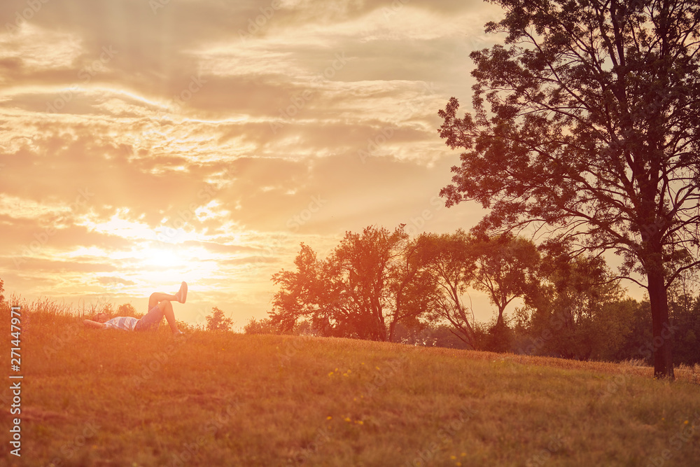 Obraz premium Man enjoying and relaxing in wheat field. Nature concept.