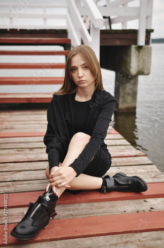 Stylish girl posing in stylish clothes