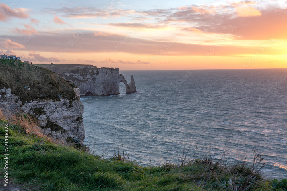 Cliffs of Étretat France with a beautiful sunset