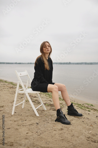 Stylish girl posing in stylish clothes