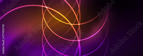 Shiny neon lights, dark abstract background with blurred magic neon light curved lines © antishock