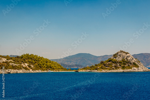 calm blue Aegean sea in the summer, the coast