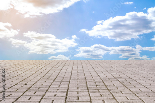 stone pavement tiles and sky with clouds 