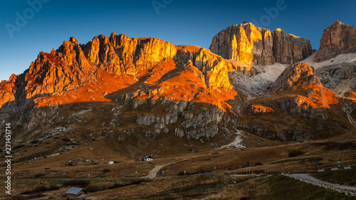 Beautiful alpine countryside. Scenic image of famous Sassolungo peak with overcast perfect blue sky. Wonderful Vall Gardena under sunlight. Majestic Dolomites Mountains. Amazing nature Landscape