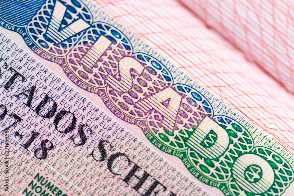 Obraz premium Stamp in the passport for travel and entry into Spain